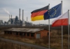 Niemcy Unia Europejska I Polska Trzy Flagi Na Tle Zrujnowanego Zakladu Przemyslowego Symbolizujace Gospodarczy Podboj Naszego Kraju Pod Unijna Bandera